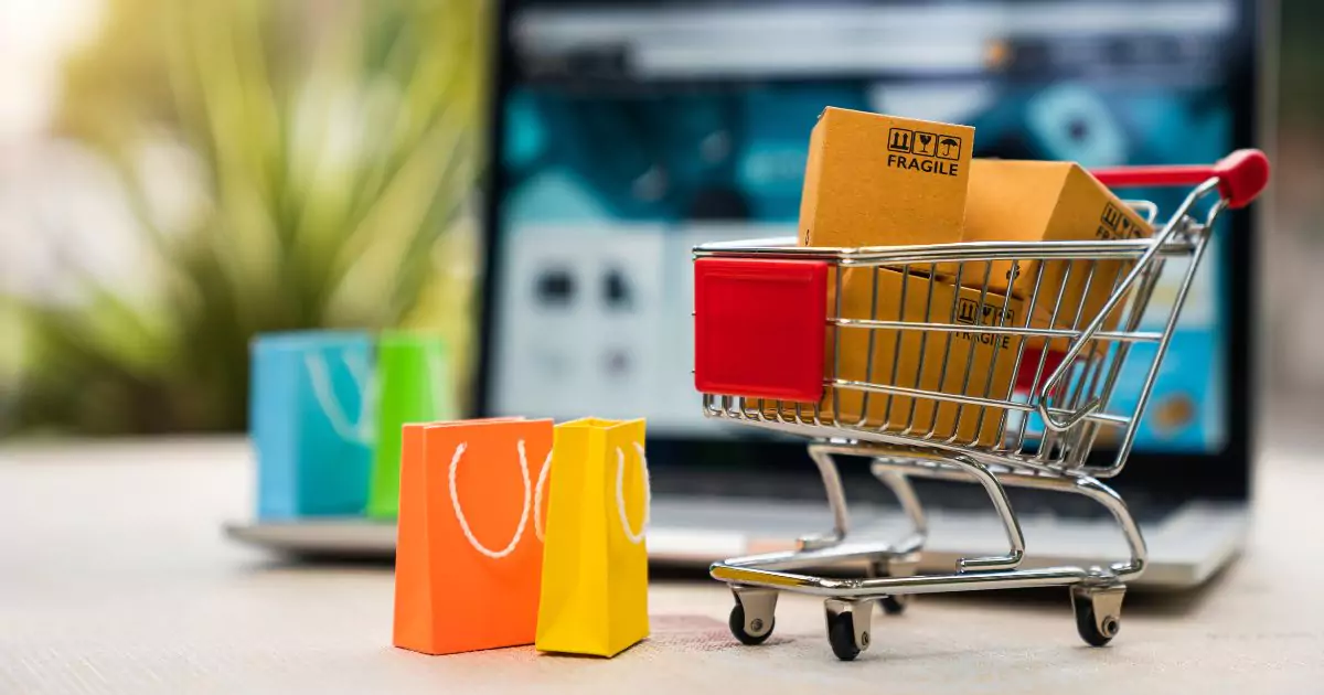 A laptop screen featuring a shopping cart, representing the concept of digital shopping and online retail.