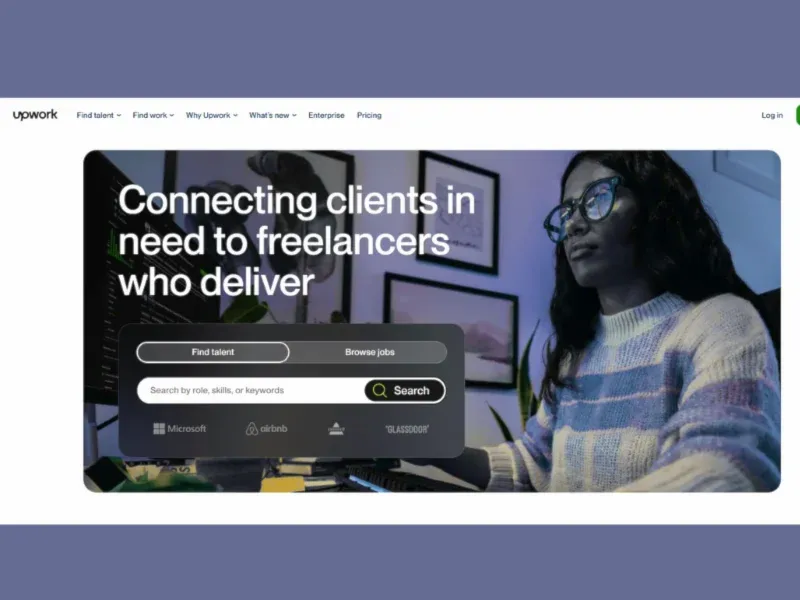 A person using a computer with Upwork's homepage displayed, emphasizing connections between clients and freelancers.